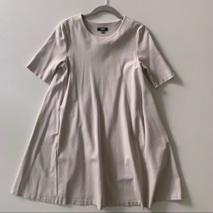 Beige flared dress with pockets